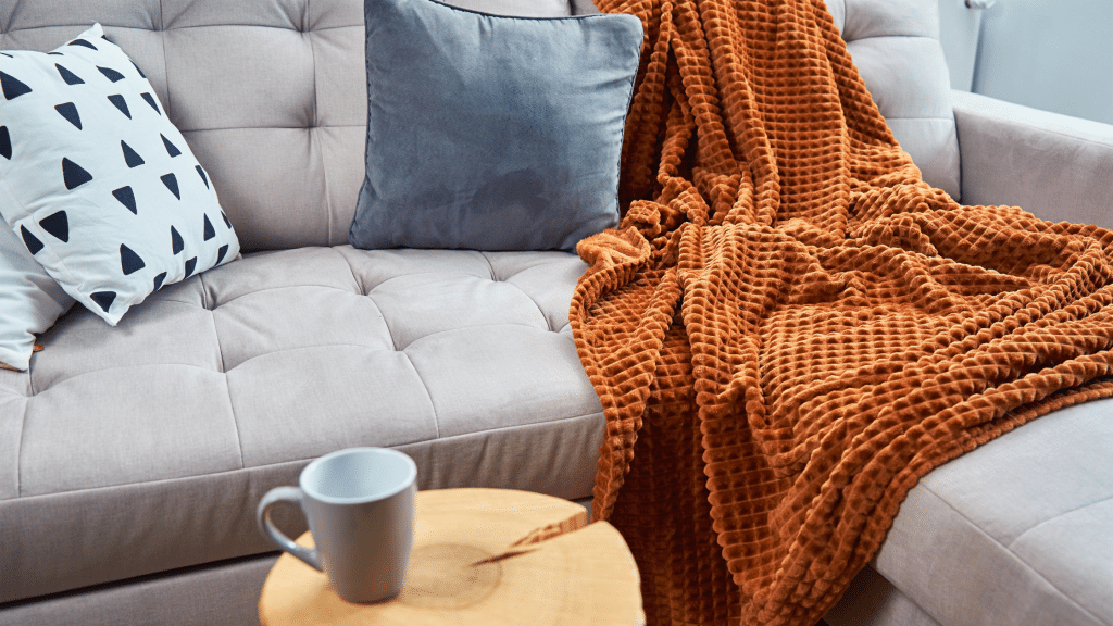 Blanket on a couch in a new home