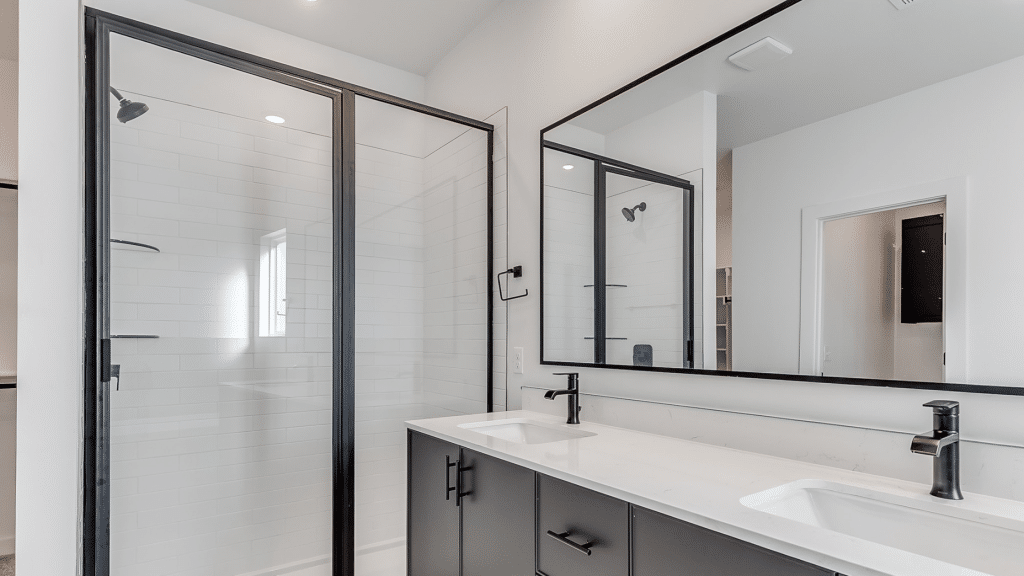 Glass shower with matte black accents
