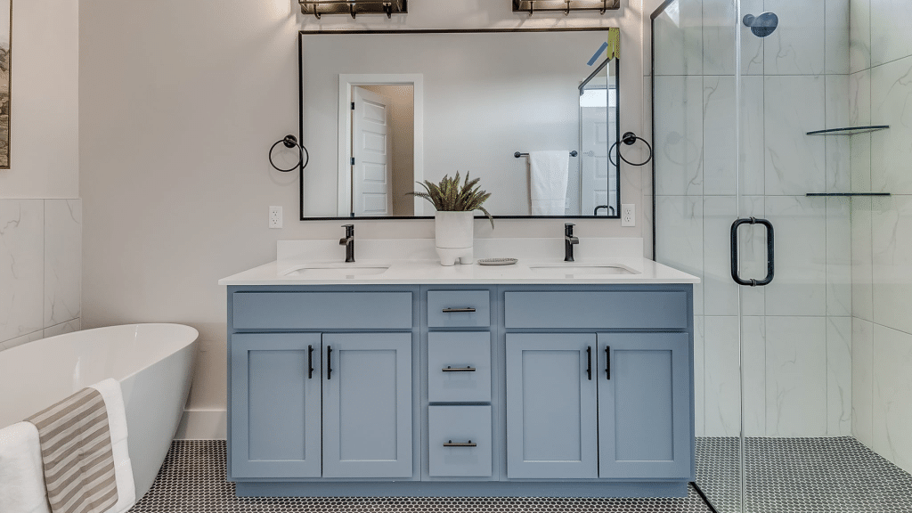 Bathroom with blue cabinet